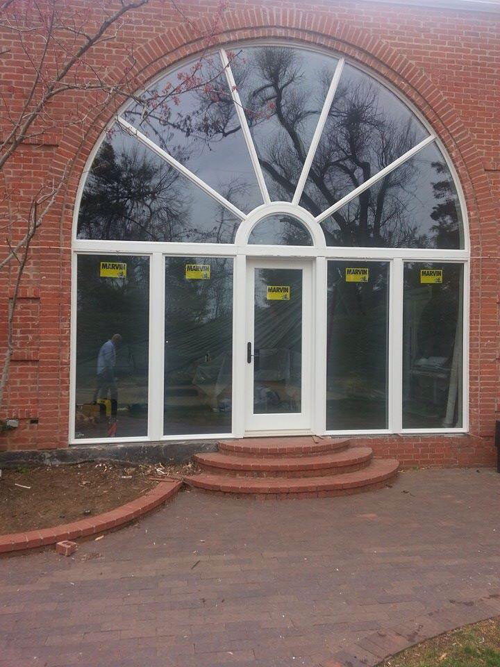 arched window with entry door
