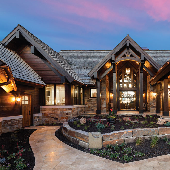 large wooden home exterior with lots of windows