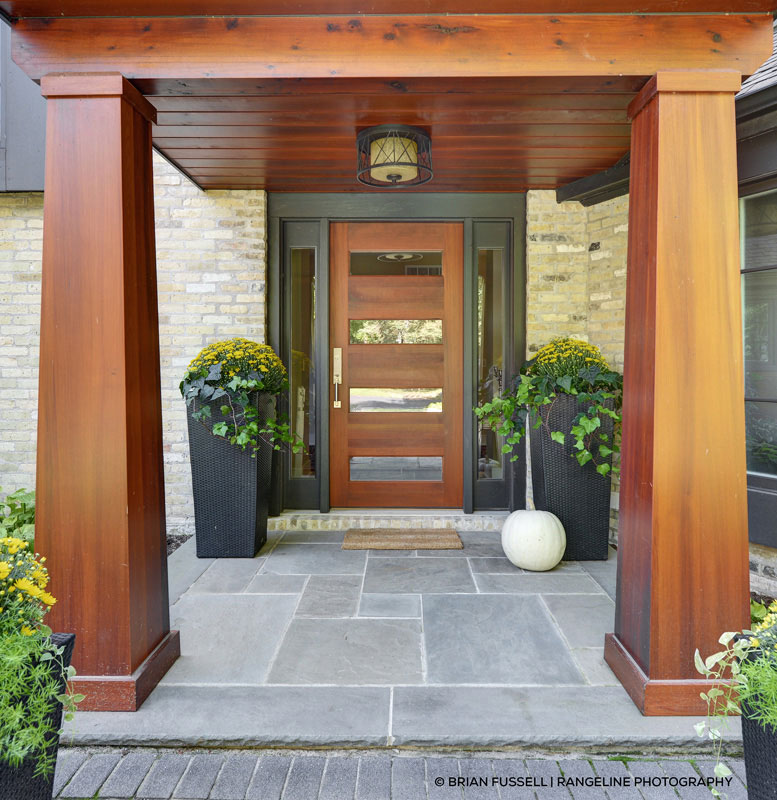 modern home with wood and metal entryway