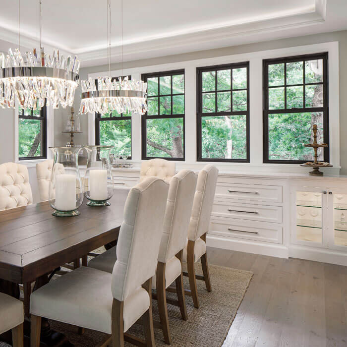 Elegant dining room with a grand chandelier and white seating in Oklahoma City, OK