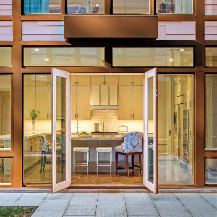 A sleek modern residence with large glass doors and windows in Oklahoma City, OK